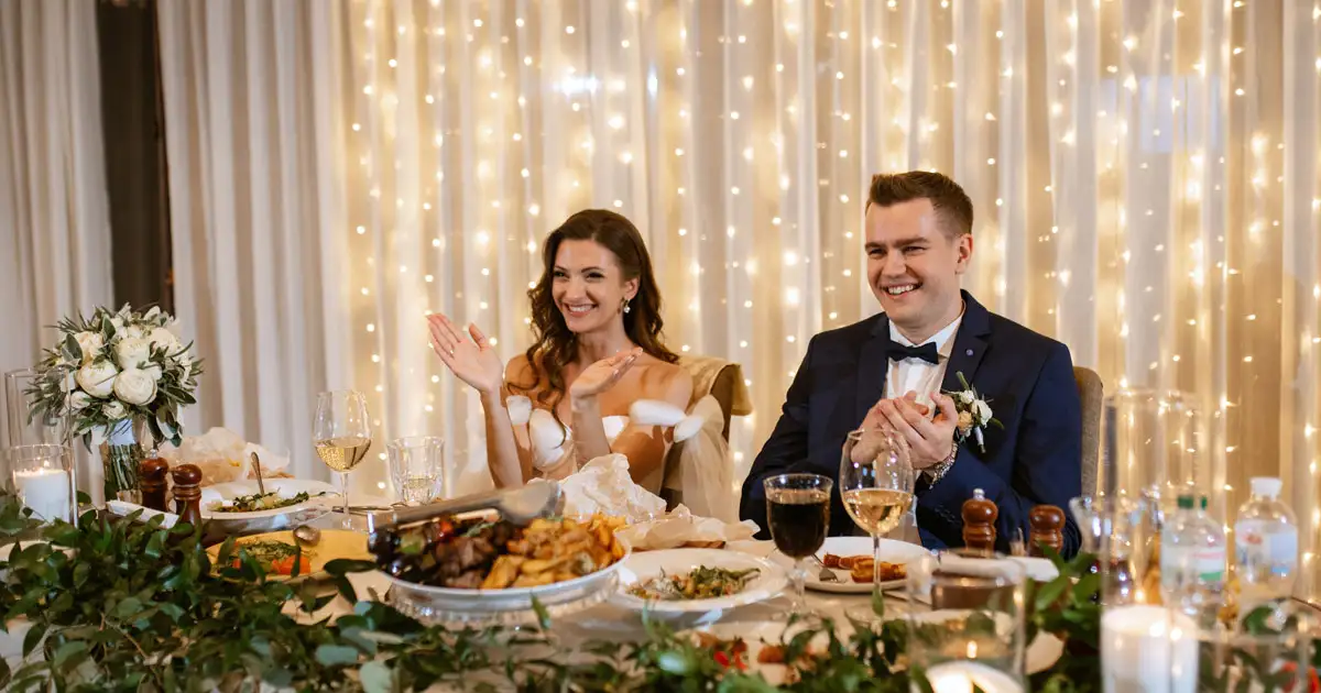 Guests socializing under warm hanging lights creating stylish evening event atmosphere