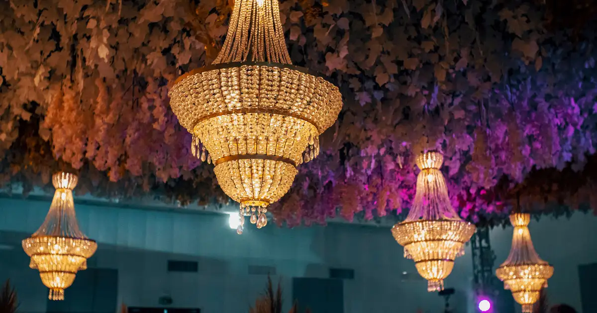 Party scene with hanging bulbs and confetti creating lively celebration lighting environment