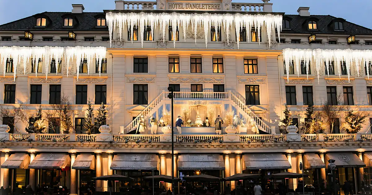 Luxury hotel facade decorated with elegant holiday lighting and icicle light installations